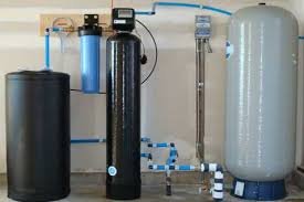 Photo of several pieces of residential water treatment equipment.